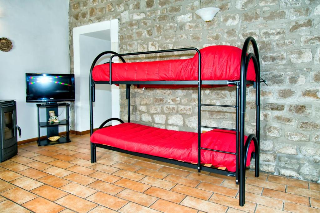 Postel nebo postele na pokoji v ubytování Il Castelletto del Salamaro
