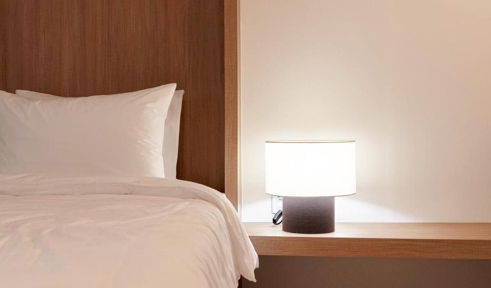Postel nebo postele na pokoji v ubytování Hotel Kyungsung