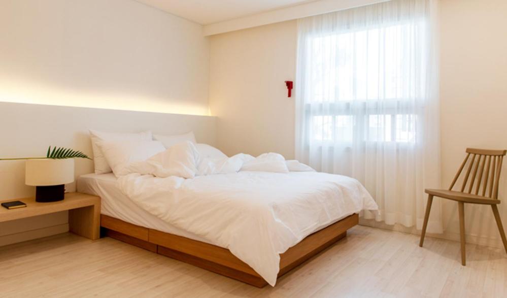 Postel nebo postele na pokoji v ubytování Hotel Kyungsung