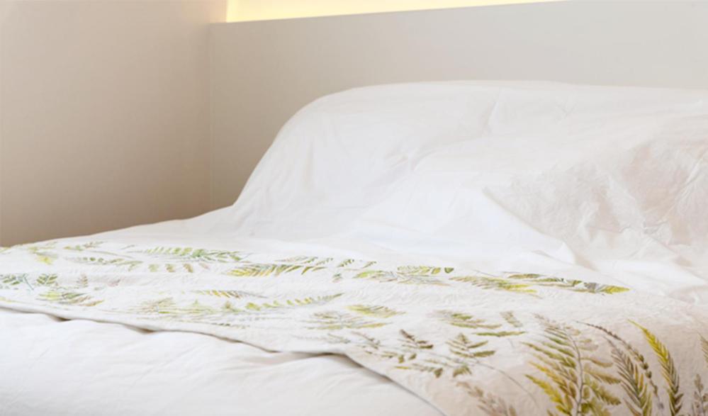 Postel nebo postele na pokoji v ubytování Hotel Kyungsung