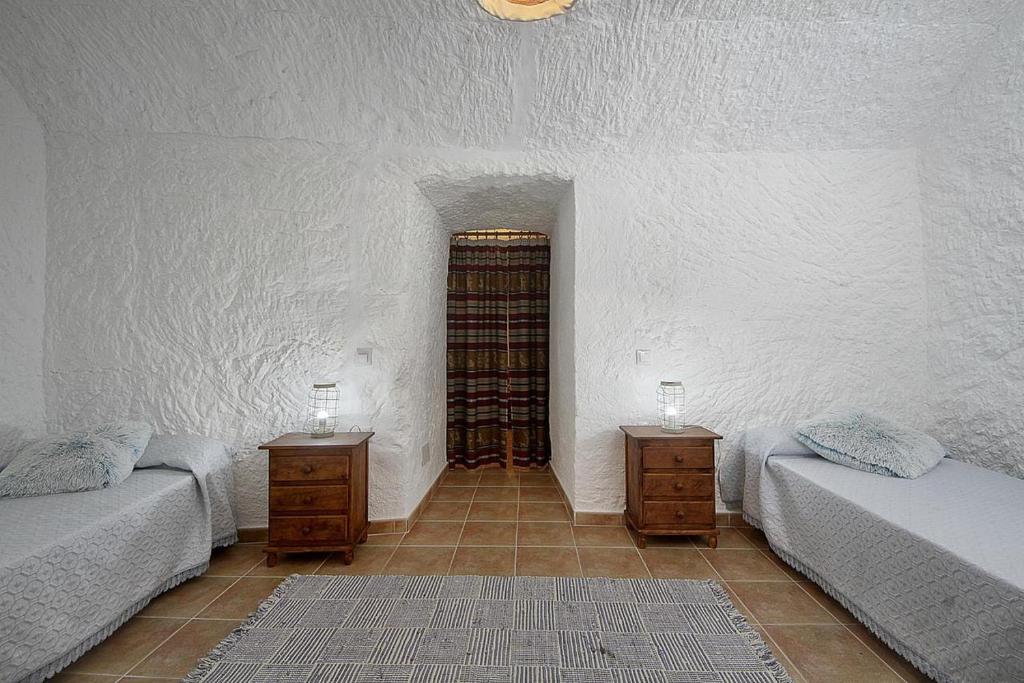 Postel nebo postele na pokoji v ubytování Cueva Solano