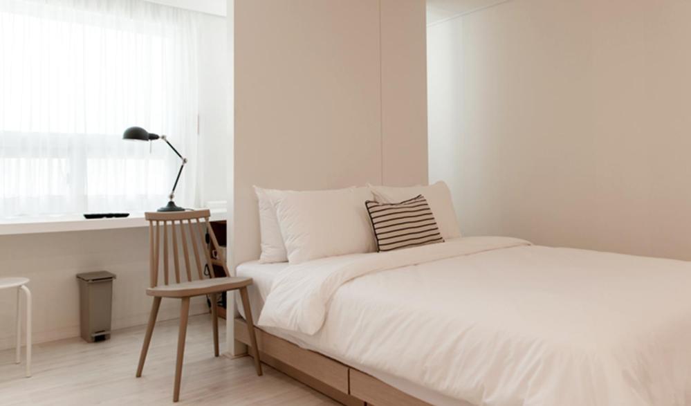 Postel nebo postele na pokoji v ubytování Hotel Kyungsung
