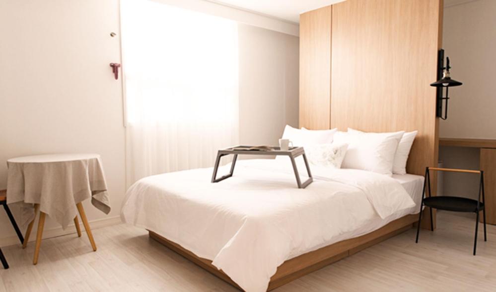 Postel nebo postele na pokoji v ubytování Hotel Kyungsung