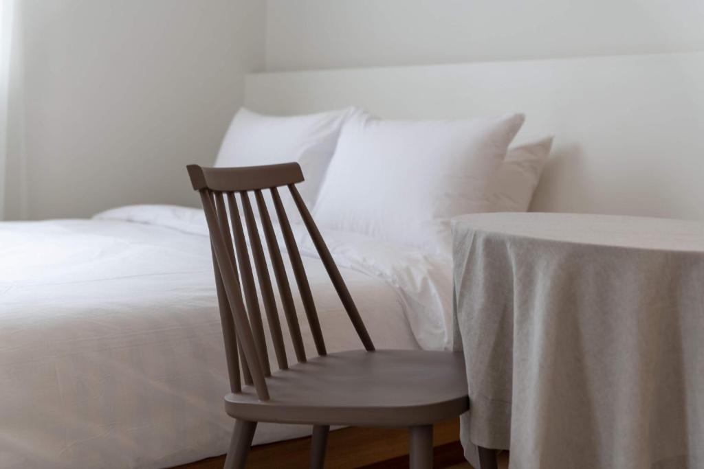 Postel nebo postele na pokoji v ubytování Hotel Kyungsung