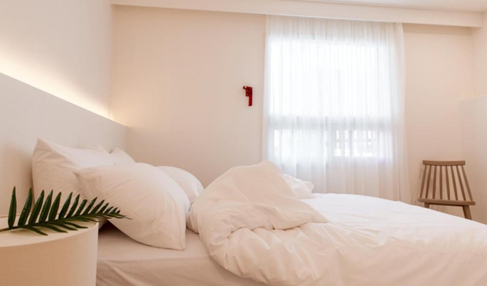 Postel nebo postele na pokoji v ubytování Hotel Kyungsung
