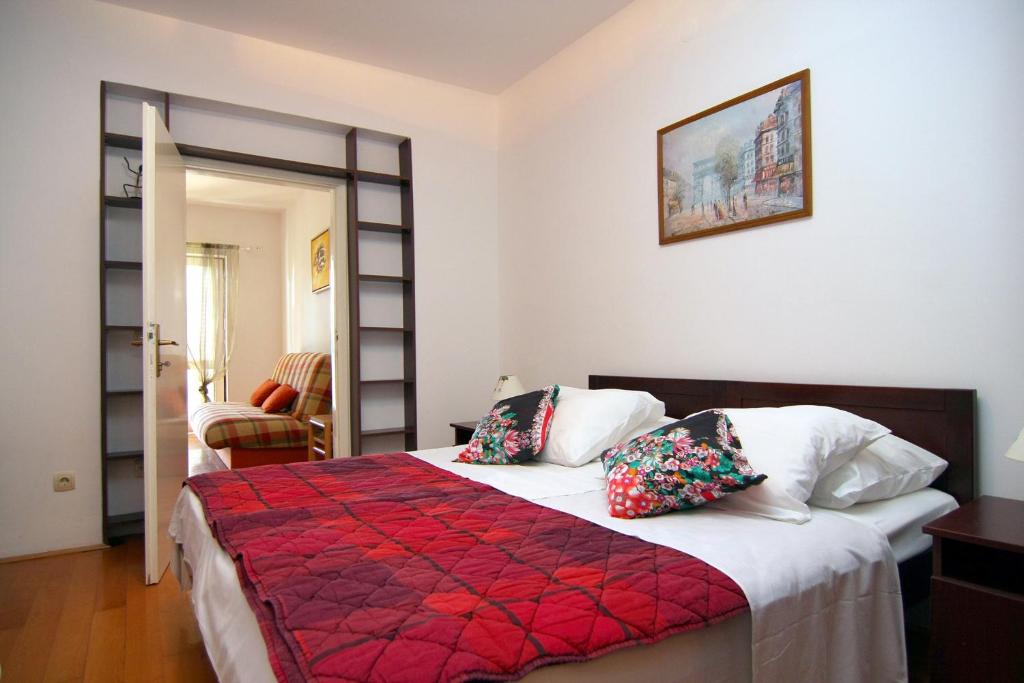 Postel nebo postele na pokoji v ubytování Nikic Apartments
