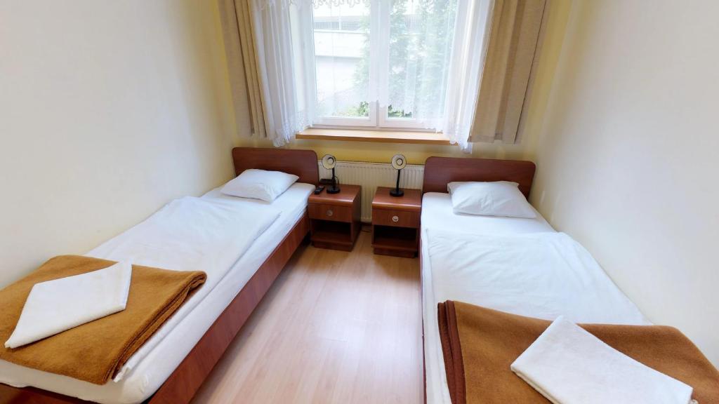 Postel nebo postele na pokoji v ubytování Noclegi Czarna Perła