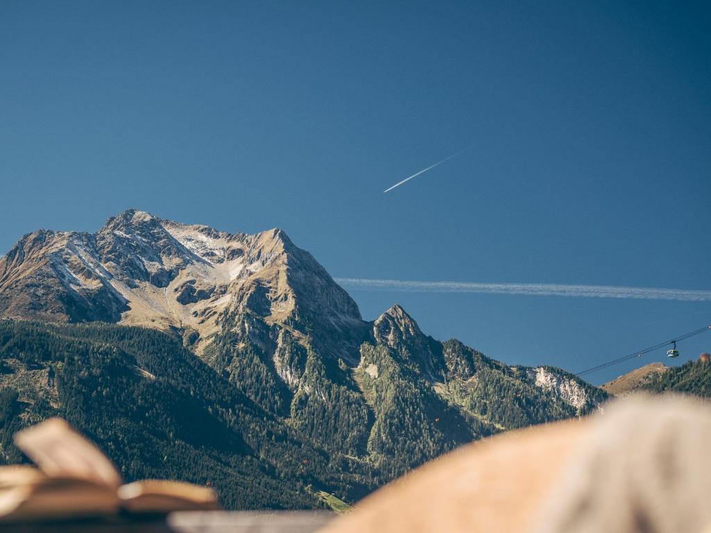 a view of a mountain with a view of a highway at Postresidenz in Mayrhofen