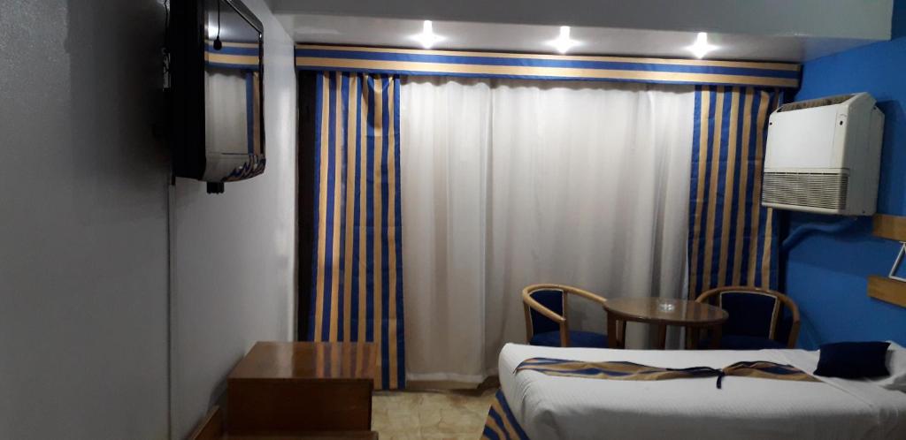 Postel nebo postele na pokoji v ubytování Marhaba Palace Hotel