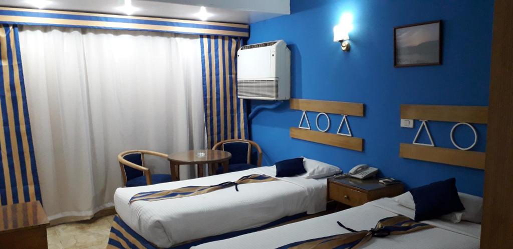 Postel nebo postele na pokoji v ubytování Marhaba Palace Hotel
