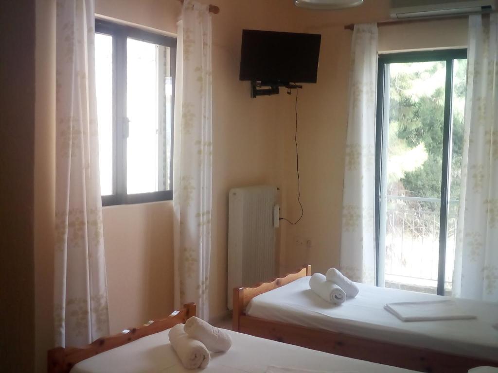 Postel nebo postele na pokoji v ubytování Hotel Ionio