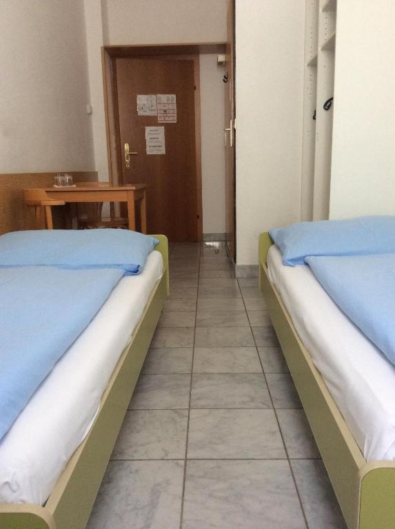 Postel nebo postele na pokoji v ubytování Hotel Pribitzer