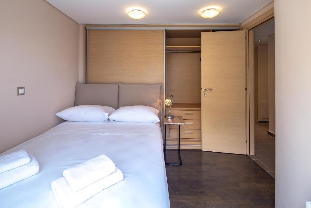 Posteľ alebo postele v izbe v ubytovaní Solon - Deluxe City Center Apartment