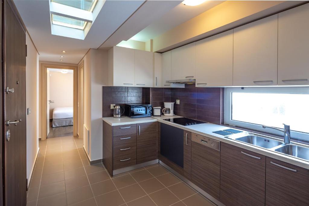 Kuchyňa alebo kuchynka v ubytovaní Solon - Deluxe City Center Apartment