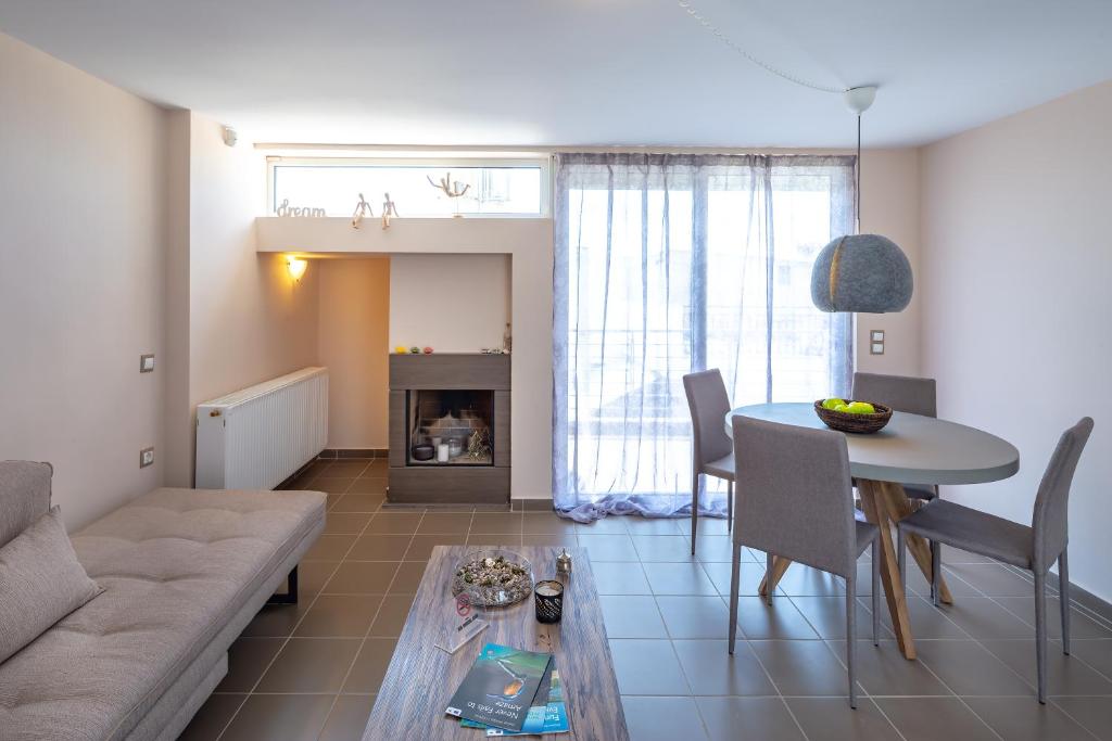 a living room with a couch and a table at Solon - Deluxe City Center Apartment in Athens