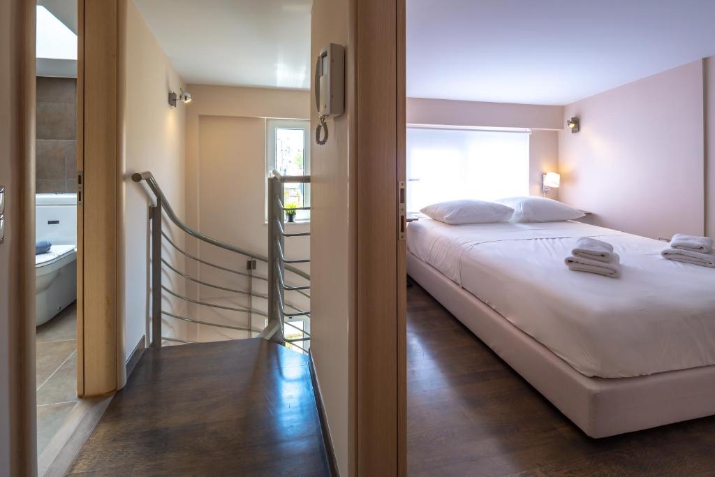 Posteľ alebo postele v izbe v ubytovaní Solon - Deluxe City Center Apartment