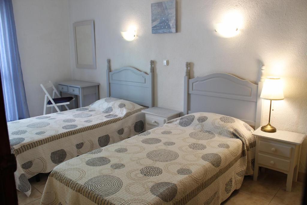 Postel nebo postele na pokoji v ubytování Hostal Nevada