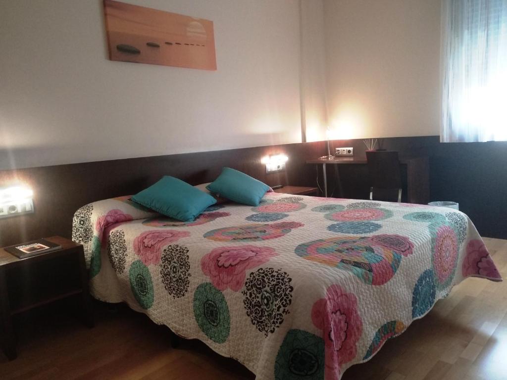 Postel nebo postele na pokoji v ubytování Hostal Nirvana