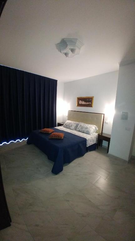 Postel nebo postele na pokoji v ubytování B&B Aquila Reale