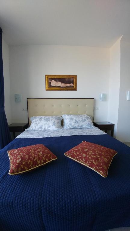 Postel nebo postele na pokoji v ubytování B&B Aquila Reale