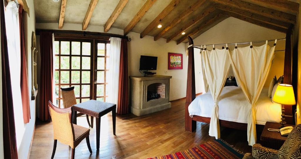 TV a/nebo společenská místnost v ubytování Guayaba Inn Boutique Hotel