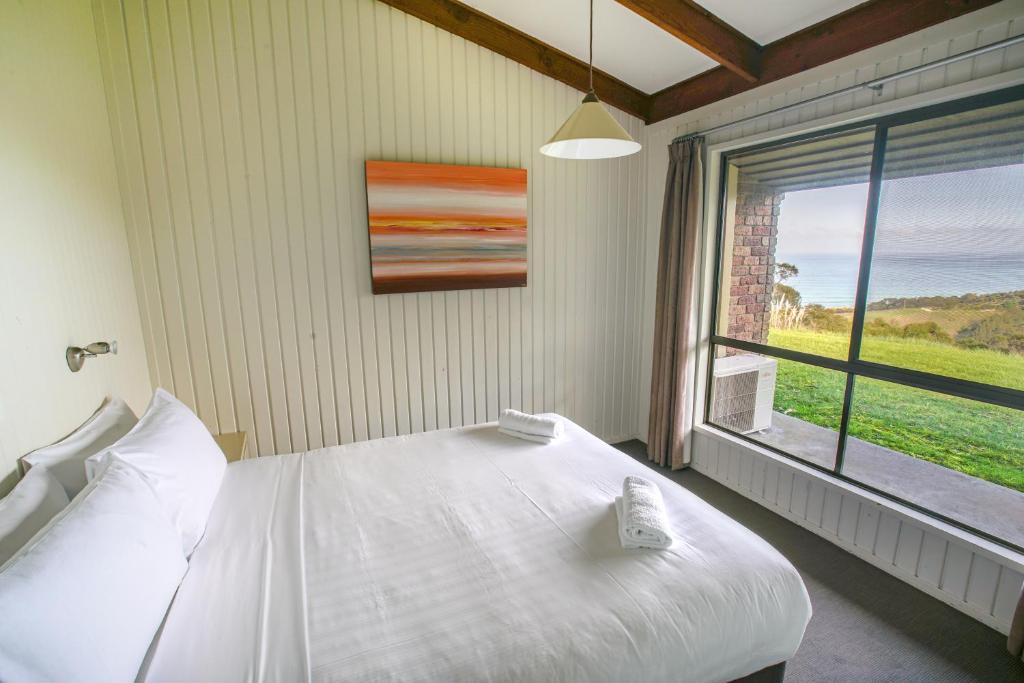 Postel nebo postele na pokoji v ubytování Beacon Point Ocean View Villas