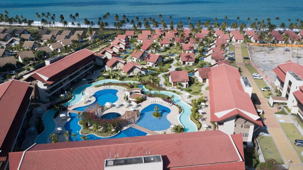 an aerial view of a resort with a swimming pool at Apto Oka Beach Residence in Porto De Galinhas