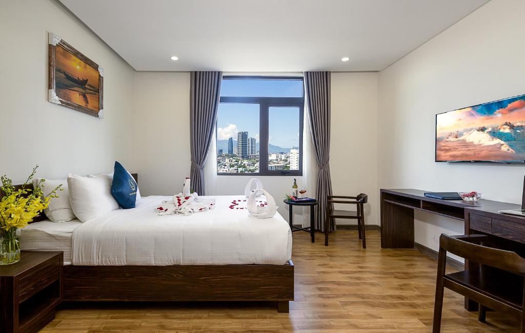Postel nebo postele na pokoji v ubytování Sepon Blue Hotel