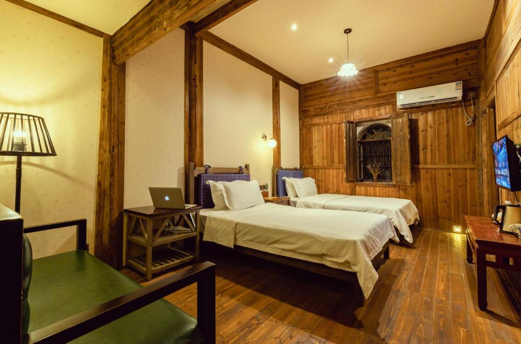 Postel nebo postele na pokoji v ubytování Pig's Boutique Hotel Bishan