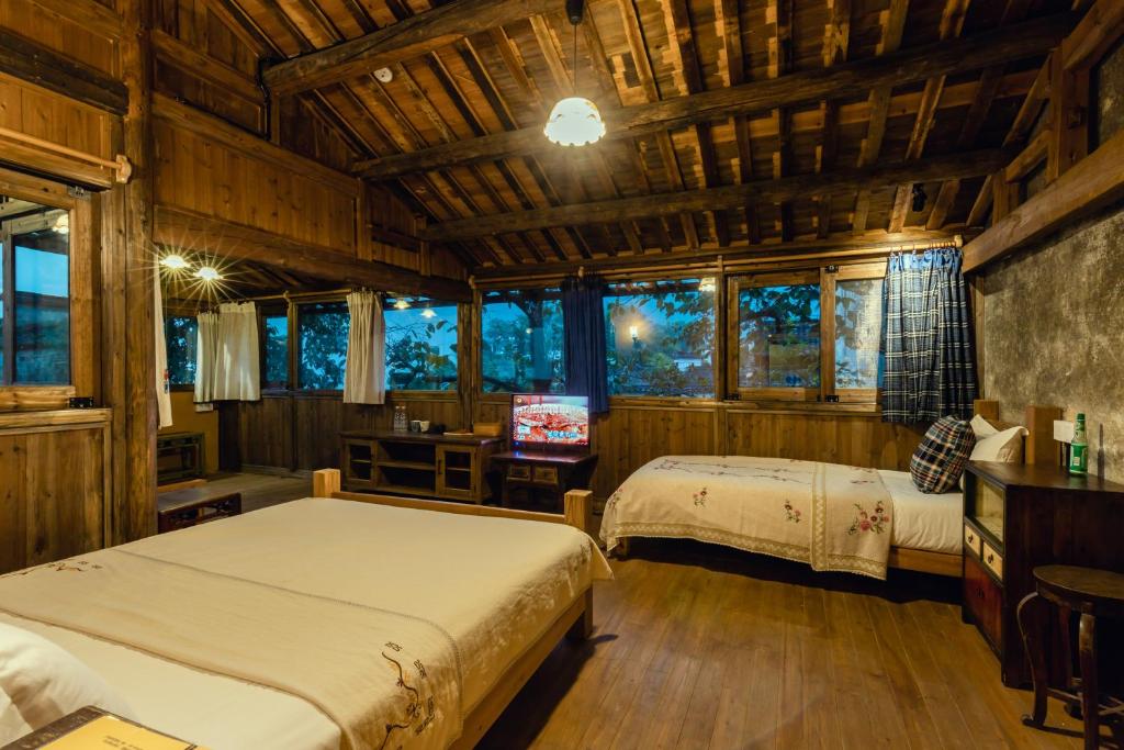 Postel nebo postele na pokoji v ubytování Pig's Boutique Hotel Bishan