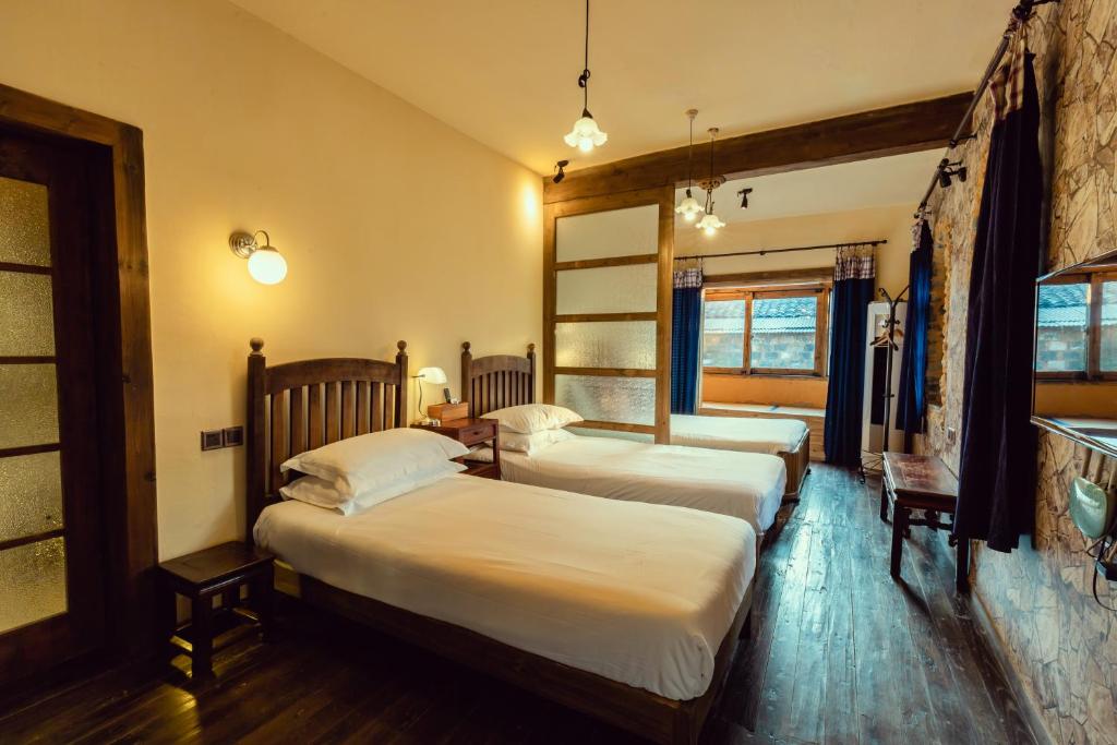 Postel nebo postele na pokoji v ubytování Pig's Boutique Hotel Bishan
