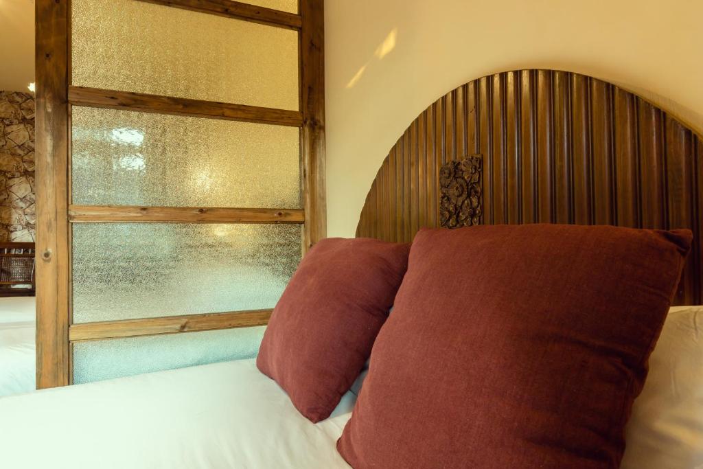 Postel nebo postele na pokoji v ubytování Pig's Boutique Hotel Bishan