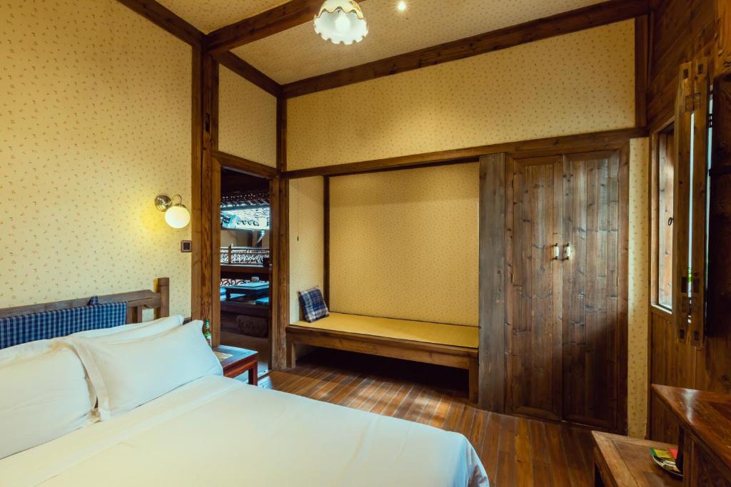 Postel nebo postele na pokoji v ubytování Pig's Boutique Hotel Bishan