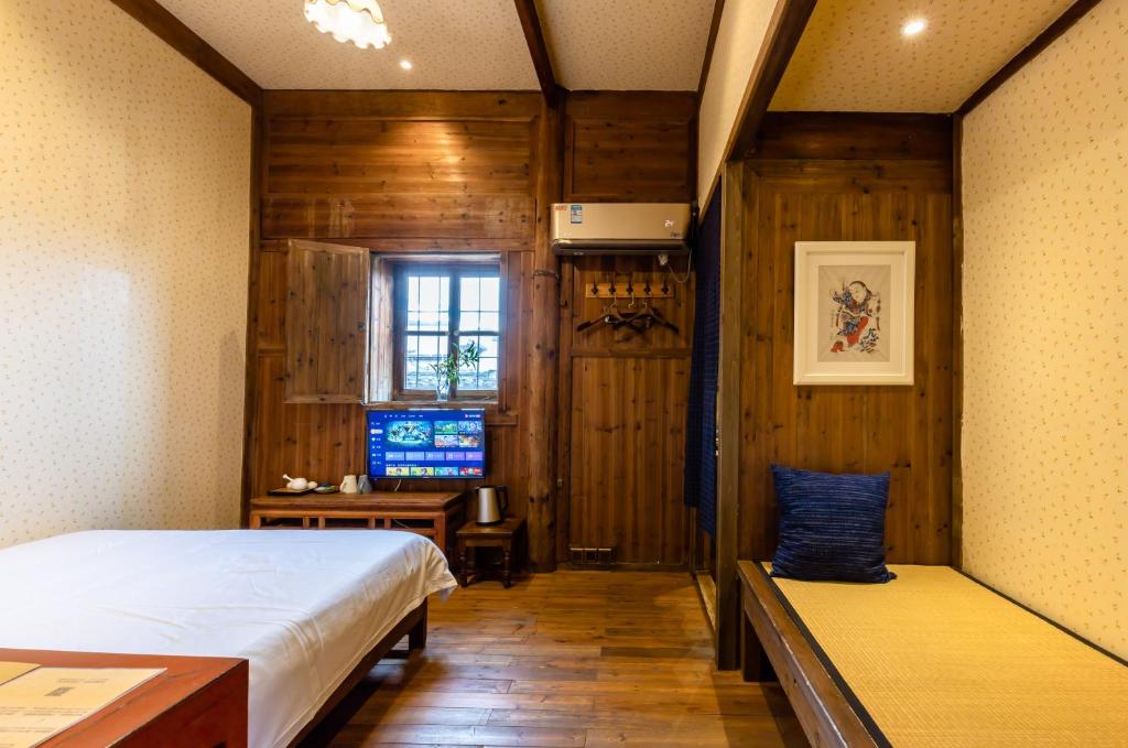 Postel nebo postele na pokoji v ubytování Pig's Boutique Hotel Bishan