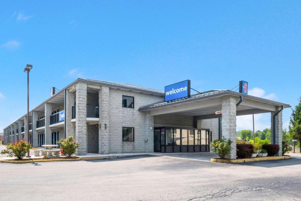 a building with a sign on the front of it at Motel 6-London, KY in London