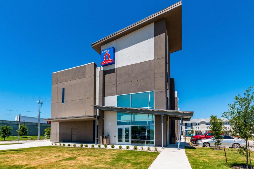 a building with a sign on the side of it at Studio 6-San Marcos, TX in San Marcos