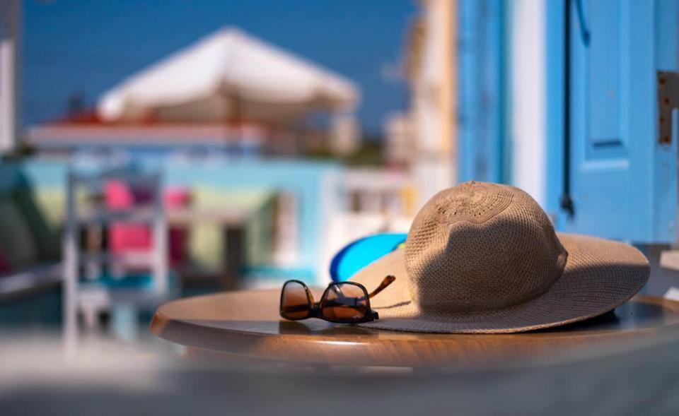 a straw hat and sunglasses sitting on a table at Amazing House in Halki in Halki