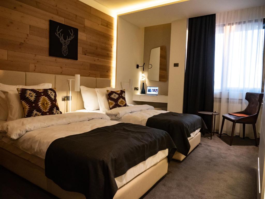 Postel nebo postele na pokoji v ubytování Hotel Putnik Kopaonik