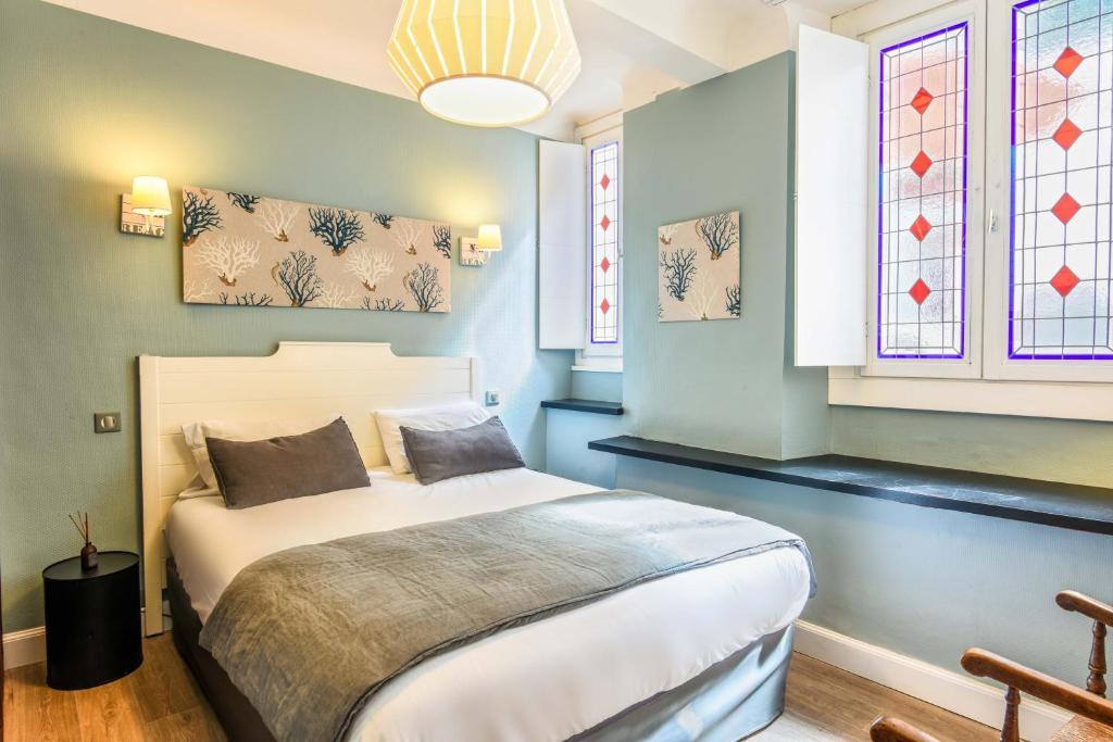Postel nebo postele na pokoji v ubytování Hotel De L'Océan