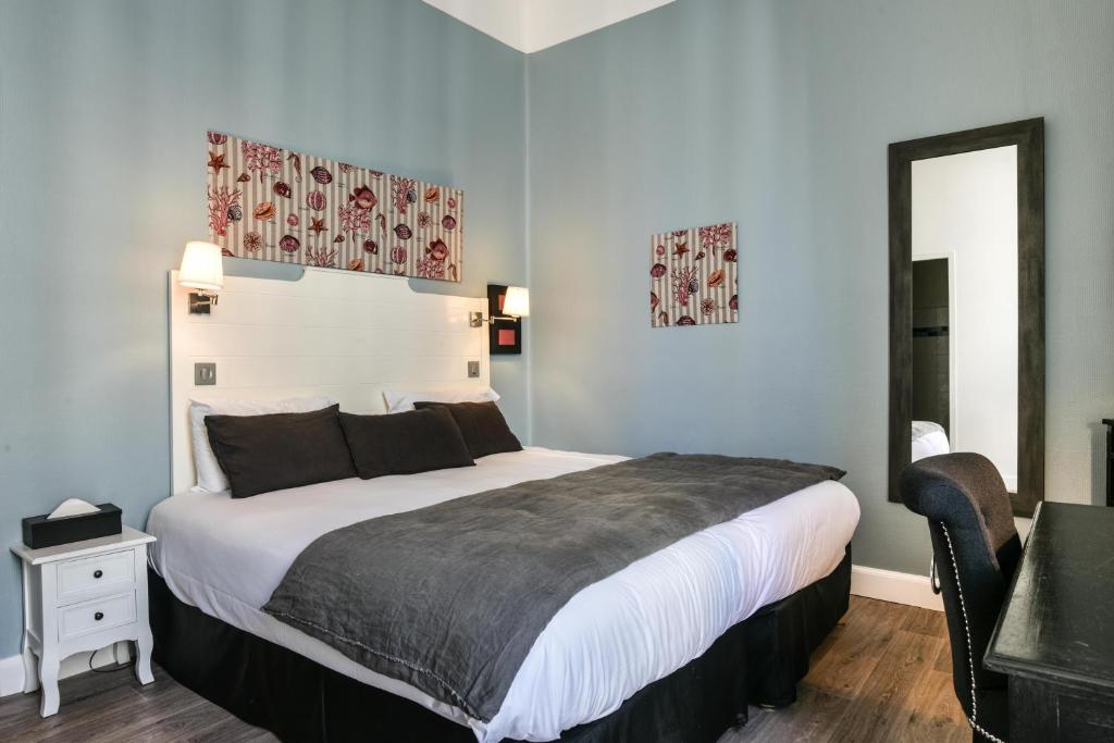 Postel nebo postele na pokoji v ubytování Hotel De L'Océan