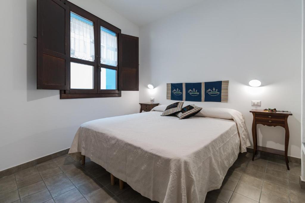 Postel nebo postele na pokoji v ubytování Ghivine Albergo Diffuso
