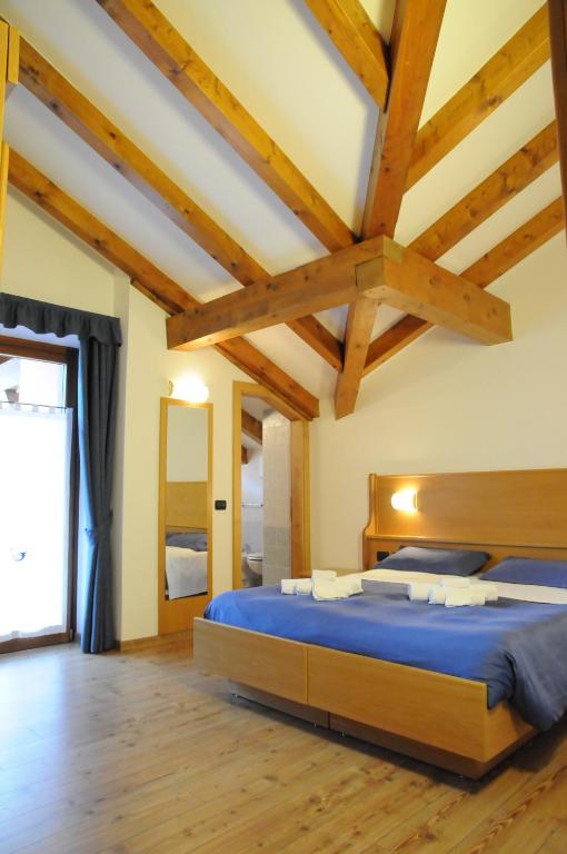 Albergo alla Postaにあるベッド