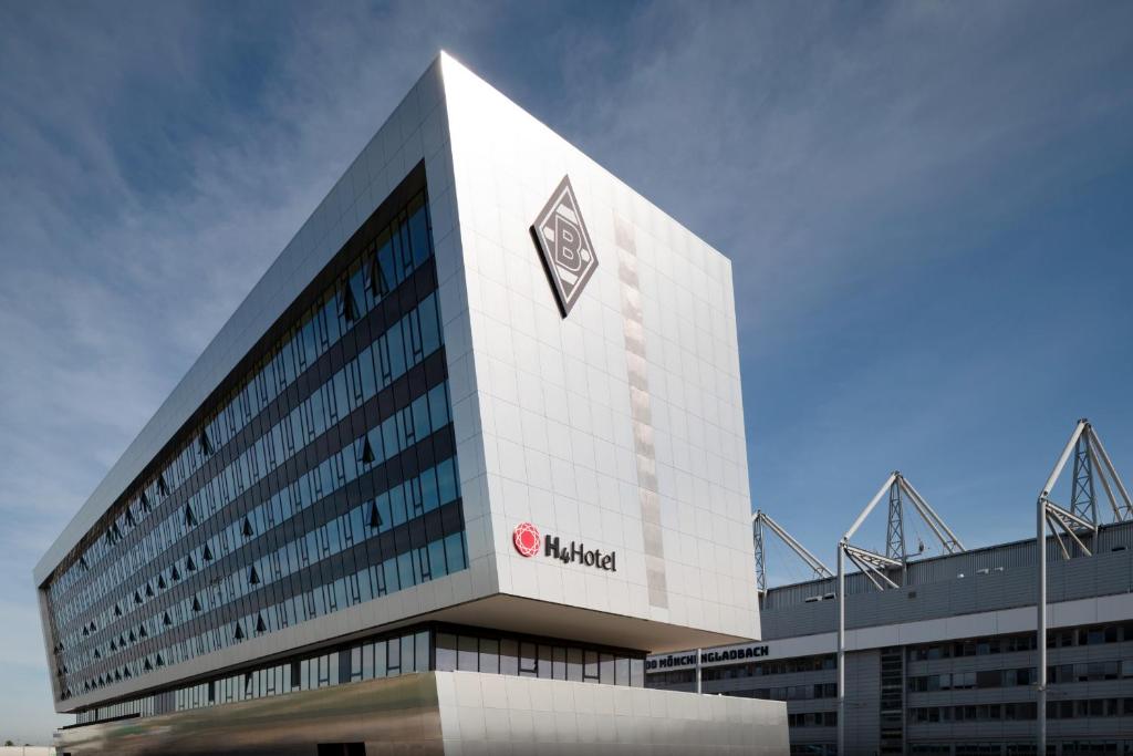 a building with a nvidia sign on the side of it at H4 Hotel Mönchengladbach im BORUSSIA-PARK in Mönchengladbach