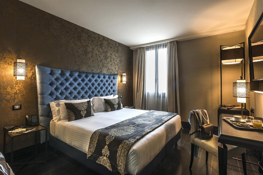 Cama ou camas em um quarto em Venice Times Hotel