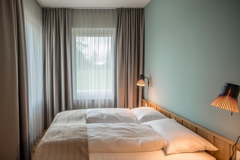 Postel nebo postele na pokoji v ubytování Aparthotel Luzern West