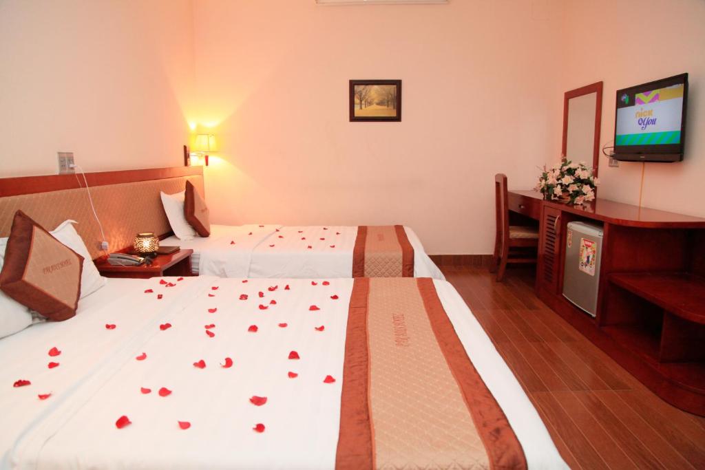 Postel nebo postele na pokoji v ubytování Paradis Hotel