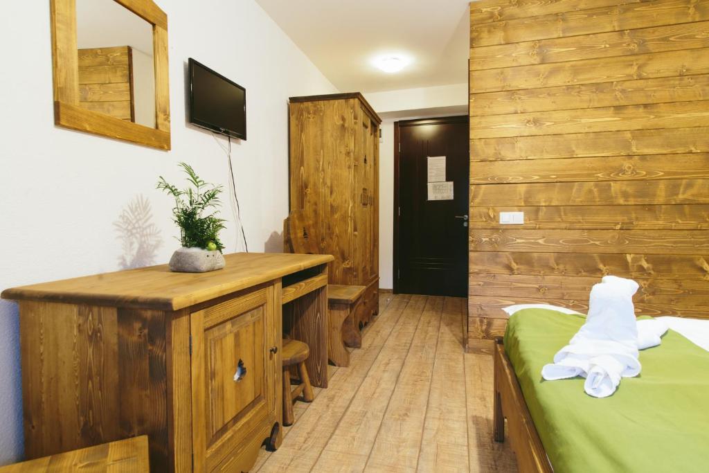 Una cama o camas en una habitación de Hotel Superski