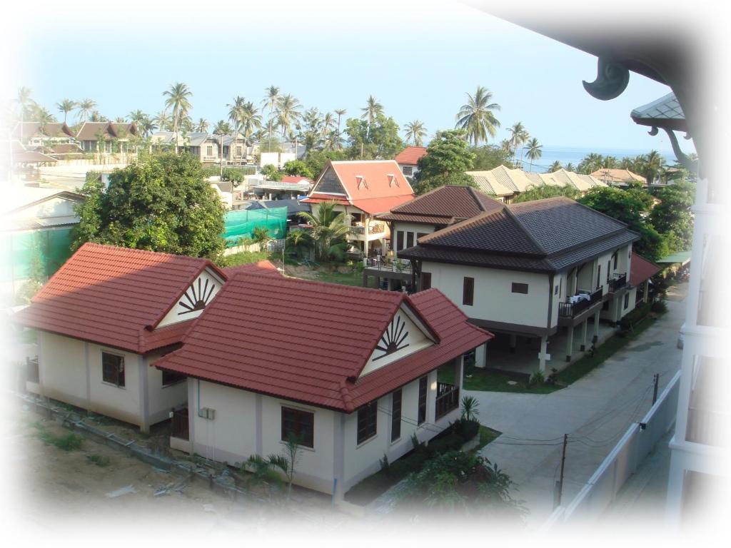 an overhead view of a group of houses with red roofs at Niracha Chaweng House in Chaweng