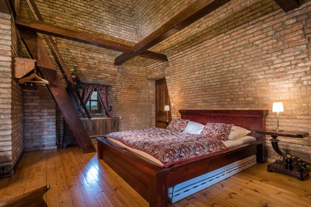 Postel nebo postele na pokoji v ubytování Chateau Krakovany