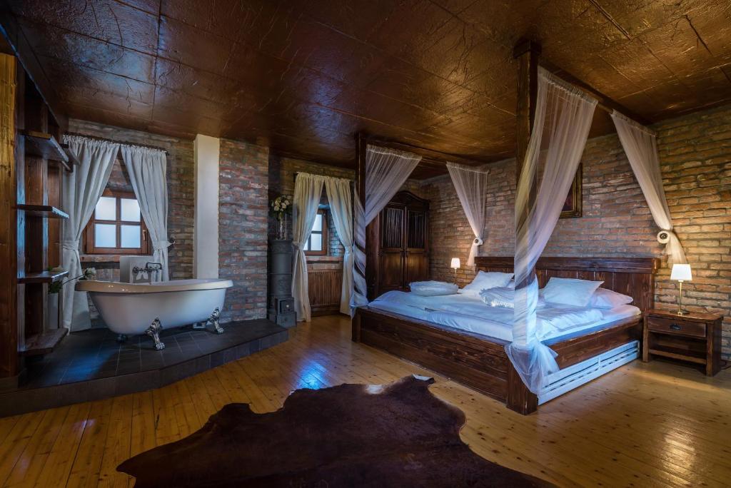Postel nebo postele na pokoji v ubytování Chateau Krakovany